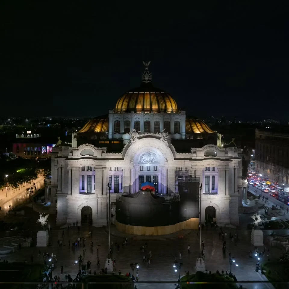 An illuminated domed building at night, from Nawaar’s Mexico photographs.